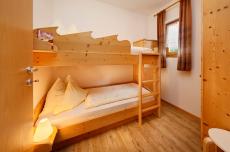 Ferienwohnung Meran − Zimmer mit Stockbett